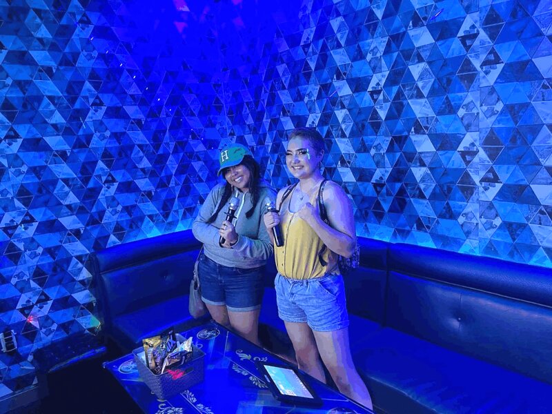 Duo singing in small room